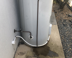 Hot water unit overflow lines also create unwanted moisture against the building